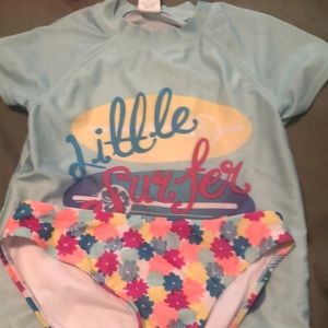 Awesome two piece swim set with short sleeve top and  Bikini bottom size 7/8